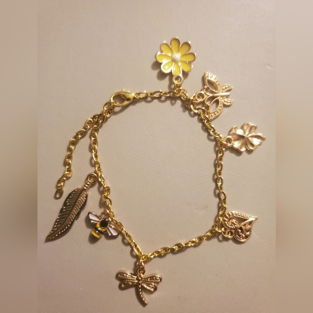 Handmade by my daughter. Gold Charm Bracelet with Floral Accents